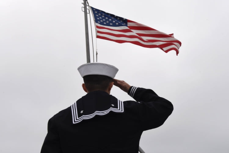 U.S. service member saluting the American flag